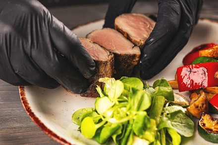 Professional chef arranging food plate, a Photo by Grafvision photography