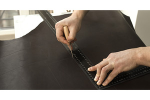 Measuring and marking leather with, a Person Photo by volodymyrshtun13795
