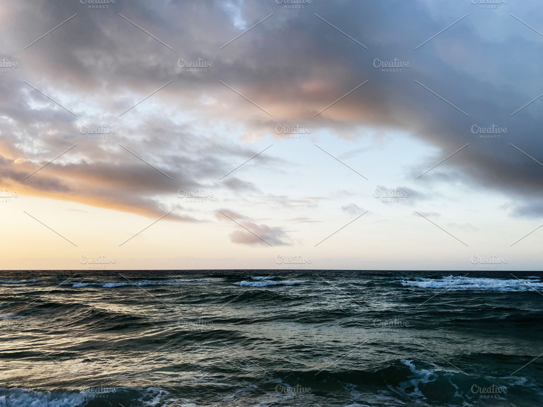 Sunset over calm Florida coast with waves under dramatic clouds in open sea at, a Nature Photo by AS photostudio