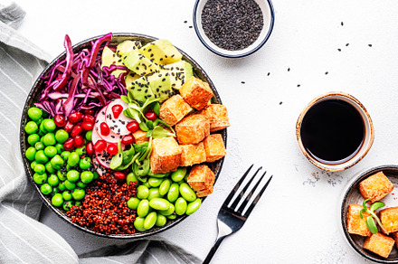 Healthy vegan food. Buddha bowl with quinoa, fried tofu, avocado, a Food & Drink Photo by 5PH