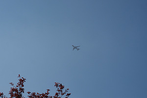 airborne plane over blue sky, a Photo by WorldOfPhotos