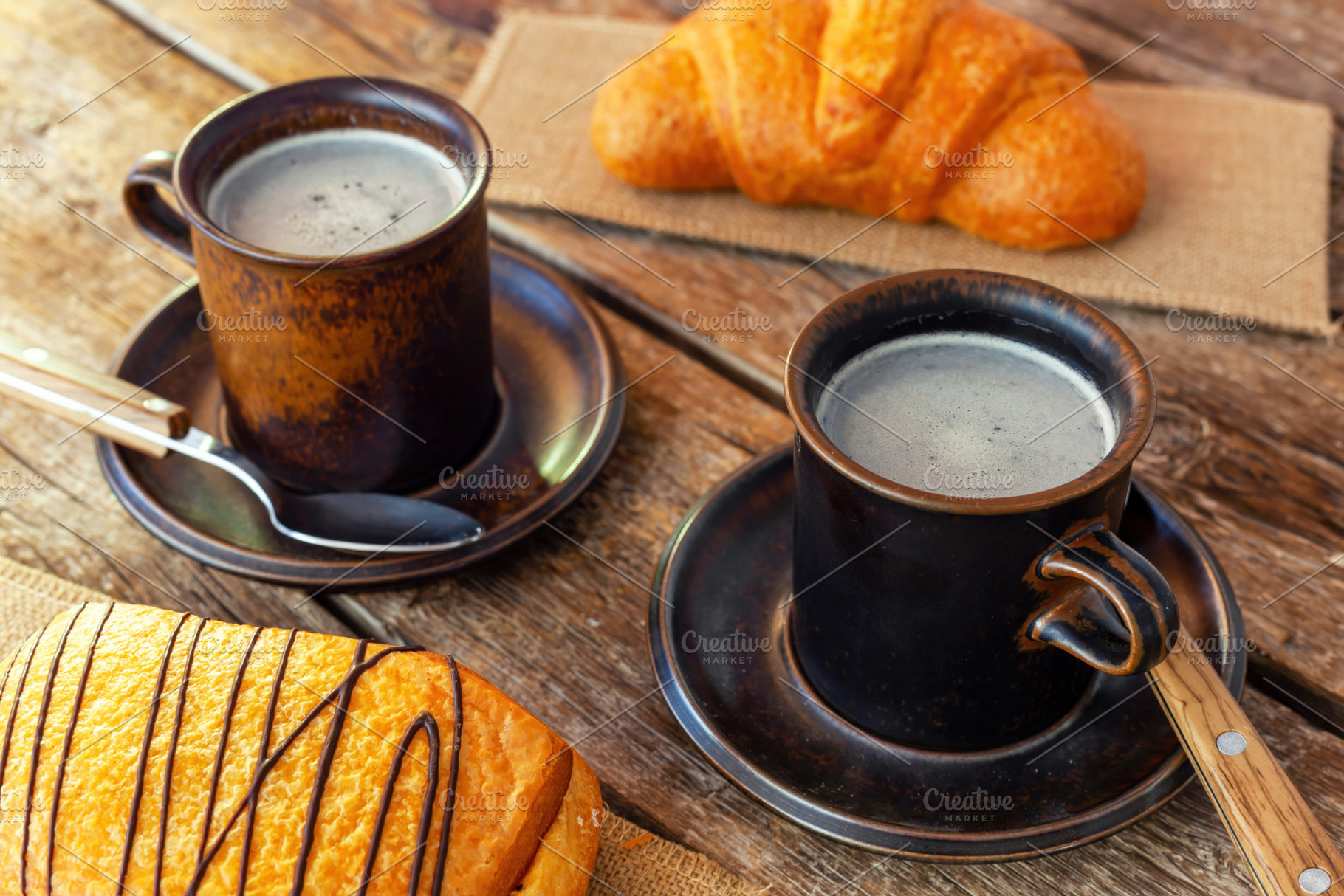 Enjoying italian breakfast with coffee and pastries on wooden table, a Food & Drink Photo by Antonio Gravante Market