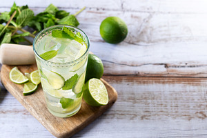 Fresh mojito cocktail with lime, mint and ice in glass, a Food & Drink Photo by etorres69