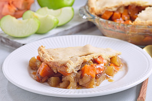 Delicious homemade apple and sweet potato cobbler pie showing filling ingredien, a Food & Drink Photo by iuliia_n