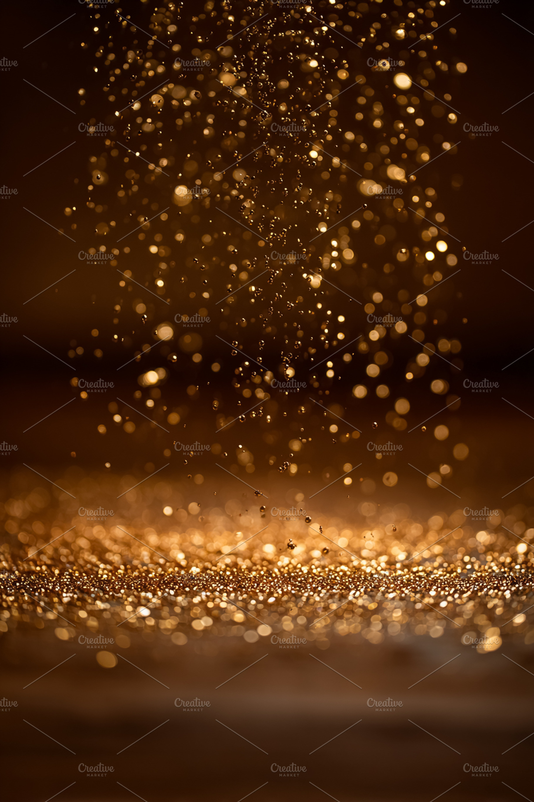 Golden glitter particles falling and shimmering on a textured surface, creating, a Photo by Studio ANNA