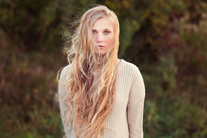 long-haired blonde in a sweater