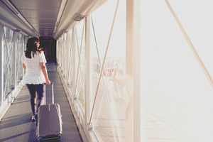 Woman on a boarding bridge
