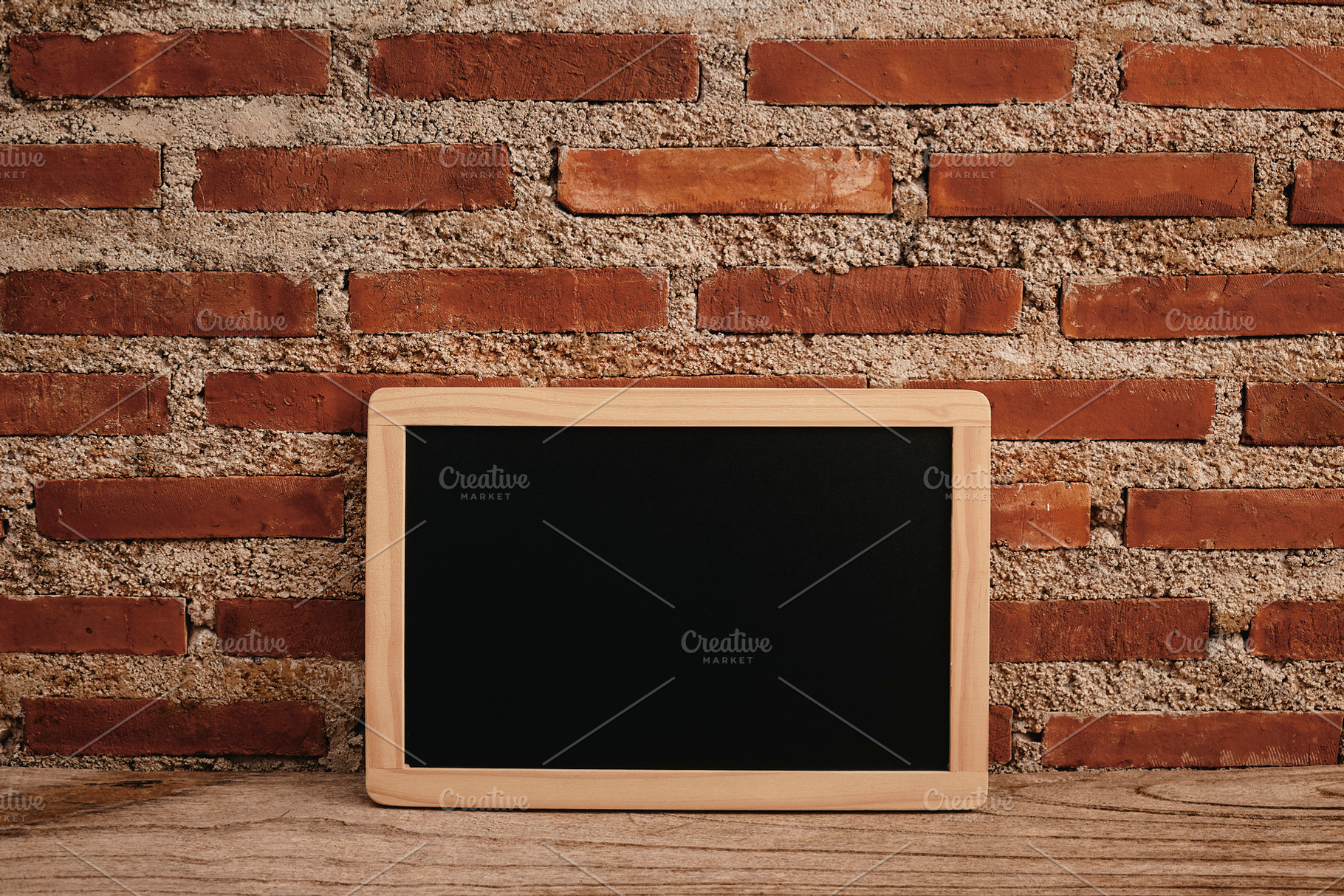 chalkboard on wooden table and brick wall, a Background Photo by 1981 Rustic studio kan