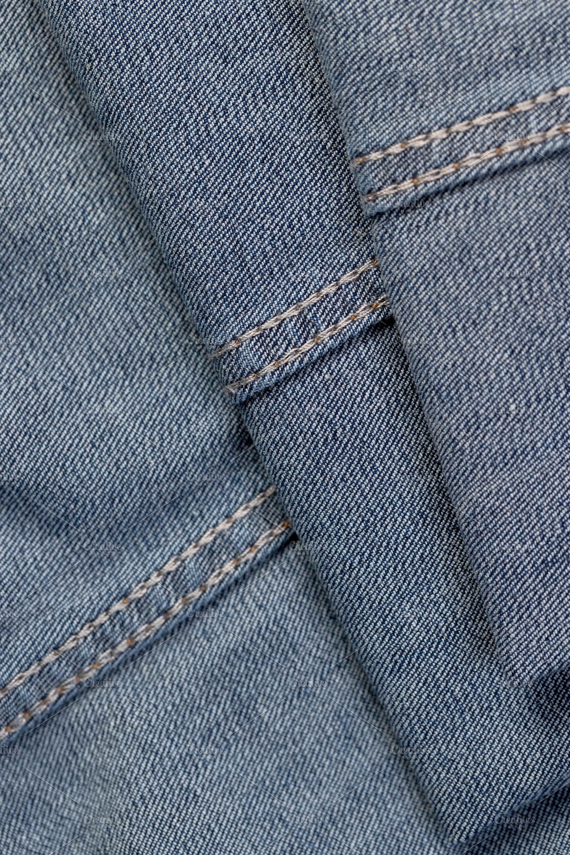 new blue denim fabric for the production of clothing and other items, a Photo by rsoollAI