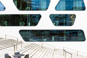 Cafe tables and modern building, an Architecture Photo by BOOCYS