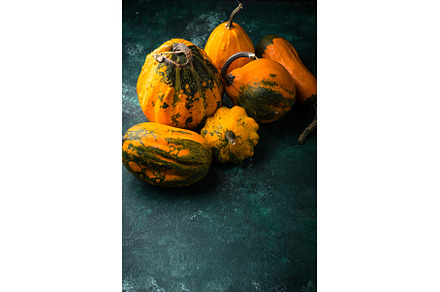 Various decorative pumpkin on green