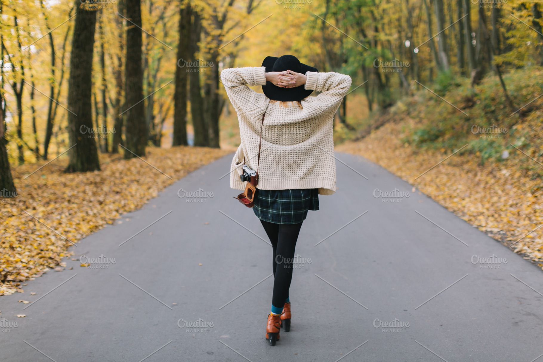 Hippie girl with old camera containing autumn, girl, and park, a Person Photo by Cherkas Photography