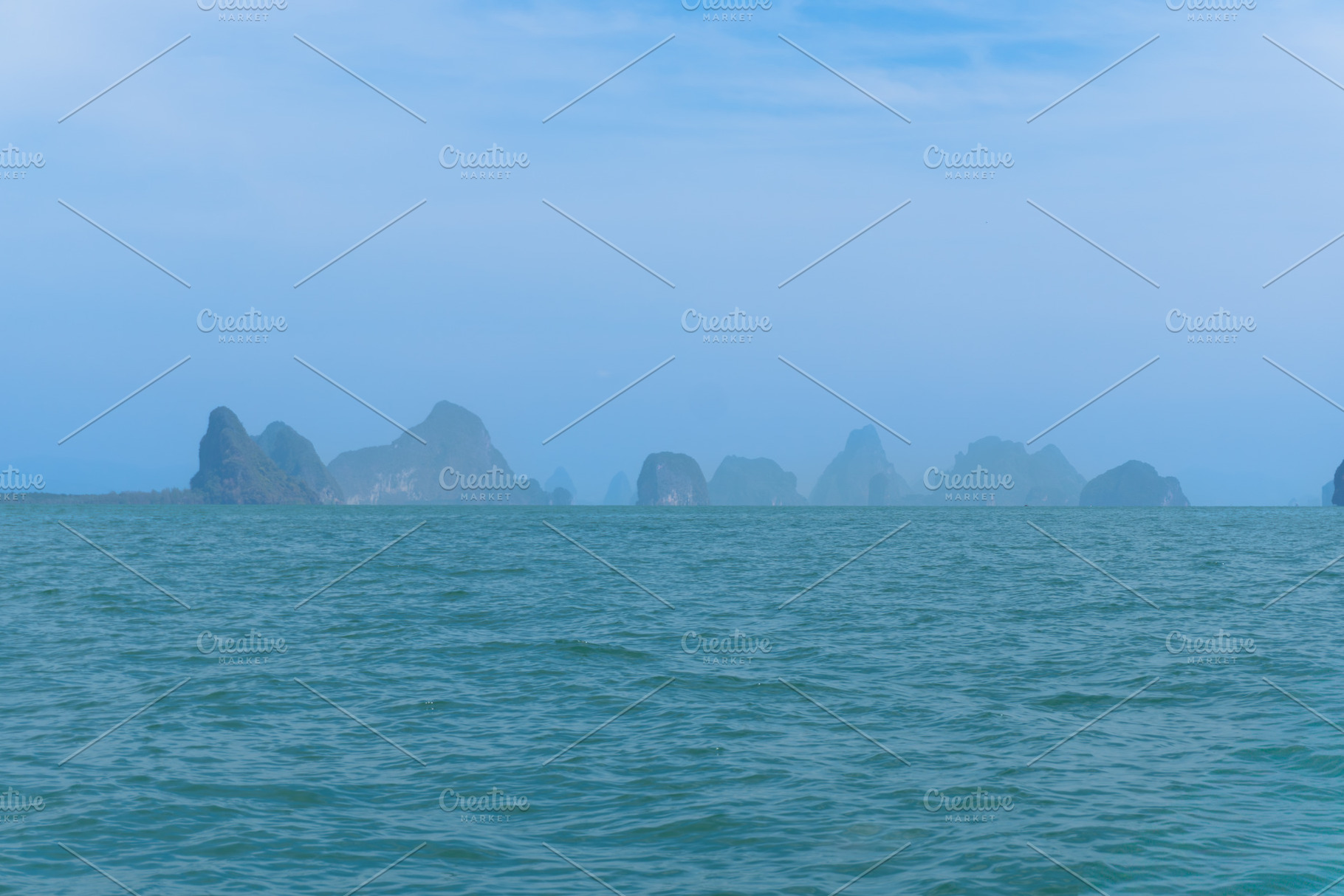 A tropical island in the blue sea, a Nature Photo by AMMi