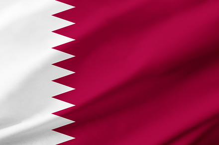Qatar flag background with waving fabric texture