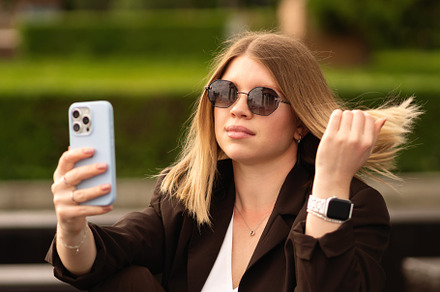 Woman sitting outdoors on bench
