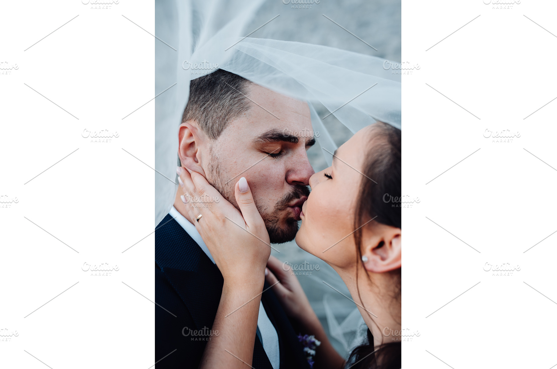 Young wedding couple kissing, a Person Photo by HalfPoint
