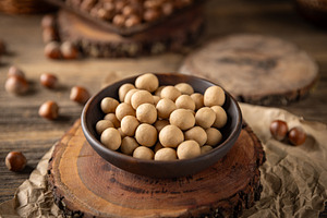 Roasted hazelnuts covered with white chocolate, a Photo by Grafvision photography