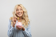 Portrait of happy woman investing in bitcoins, putting golden crypto coin into, a Photo by Prostock-Studio (Thumbnail 2 of 2)