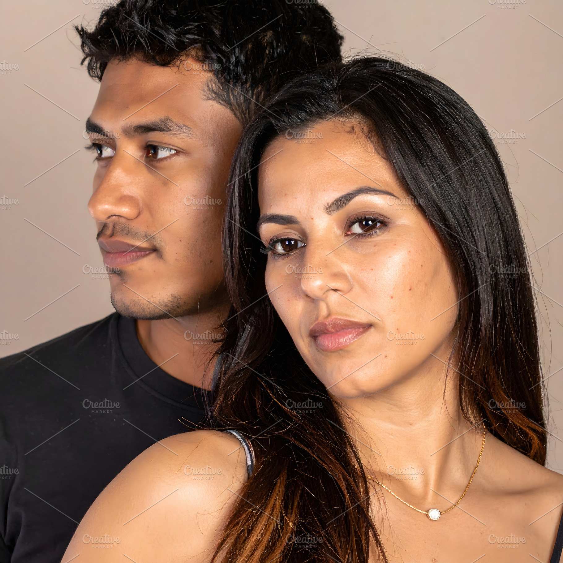 Young couple portrait with woman looking forward confidently, a Person Photo by GoodGoods