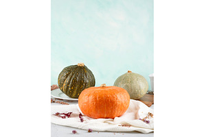 Three vibrant pumpkins stillife on, a Food & Drink Photo by Lifemorning