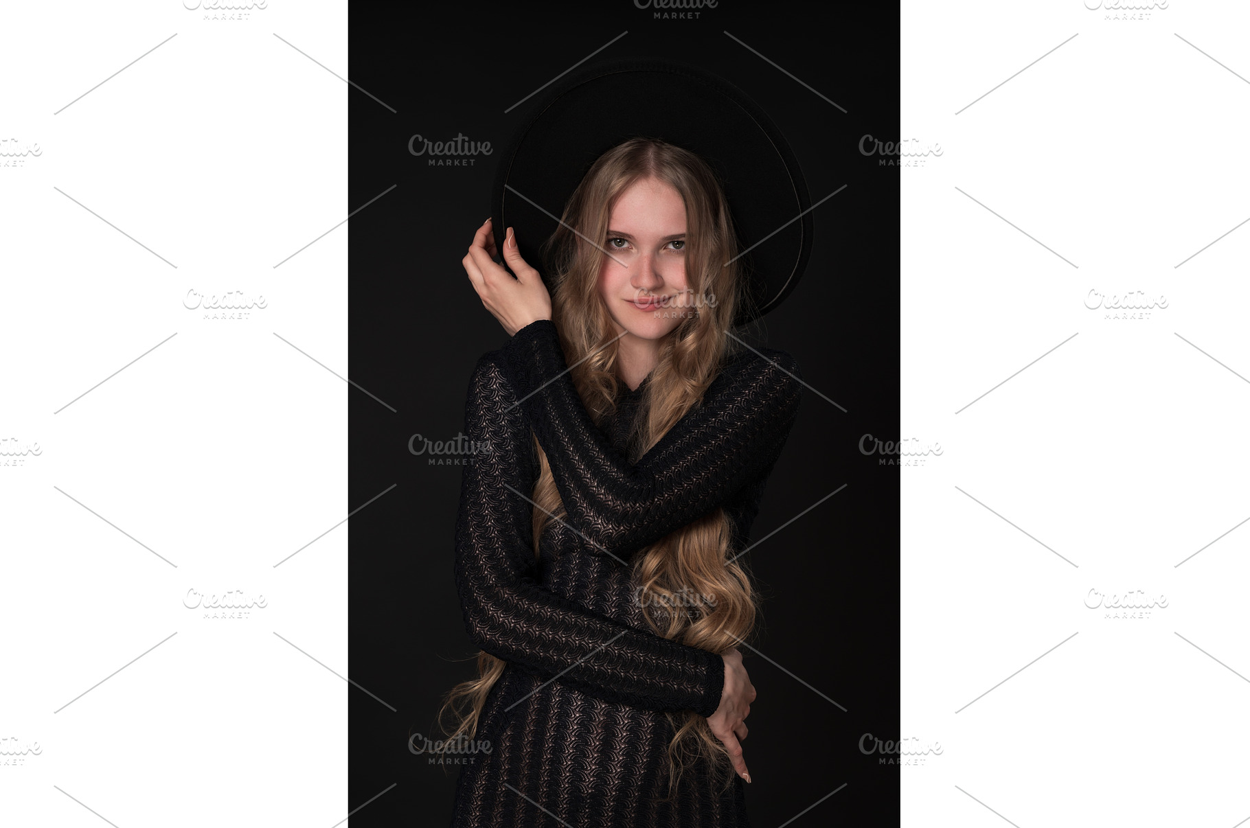 Woman with smirk on lips holds brim, a Person Photo by Alexander-Piragis