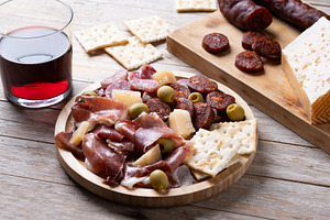 Spanish charcuterie board with serrano ham, chorizo and cheese, a Food & Drink Photo by etorres69