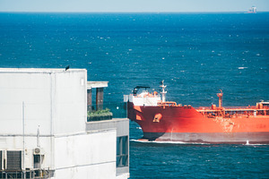 Red oil tanker at sea telephoto view, a Transportation Photo by SkyNext