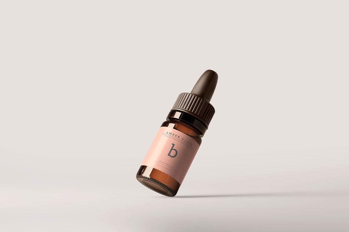 Amber Glass Dropper Bottle Mockups, a Cups & Container Mockup by pmvch (Photo 11 of 20)