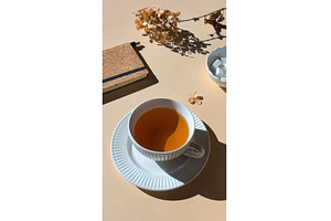 Cup of tea in white ceramic cup with, a Photo by tilialucida