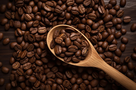 Coffee beans with wooden spoon. Generative AI, a Food & Drink Photo by AlyaAnd
