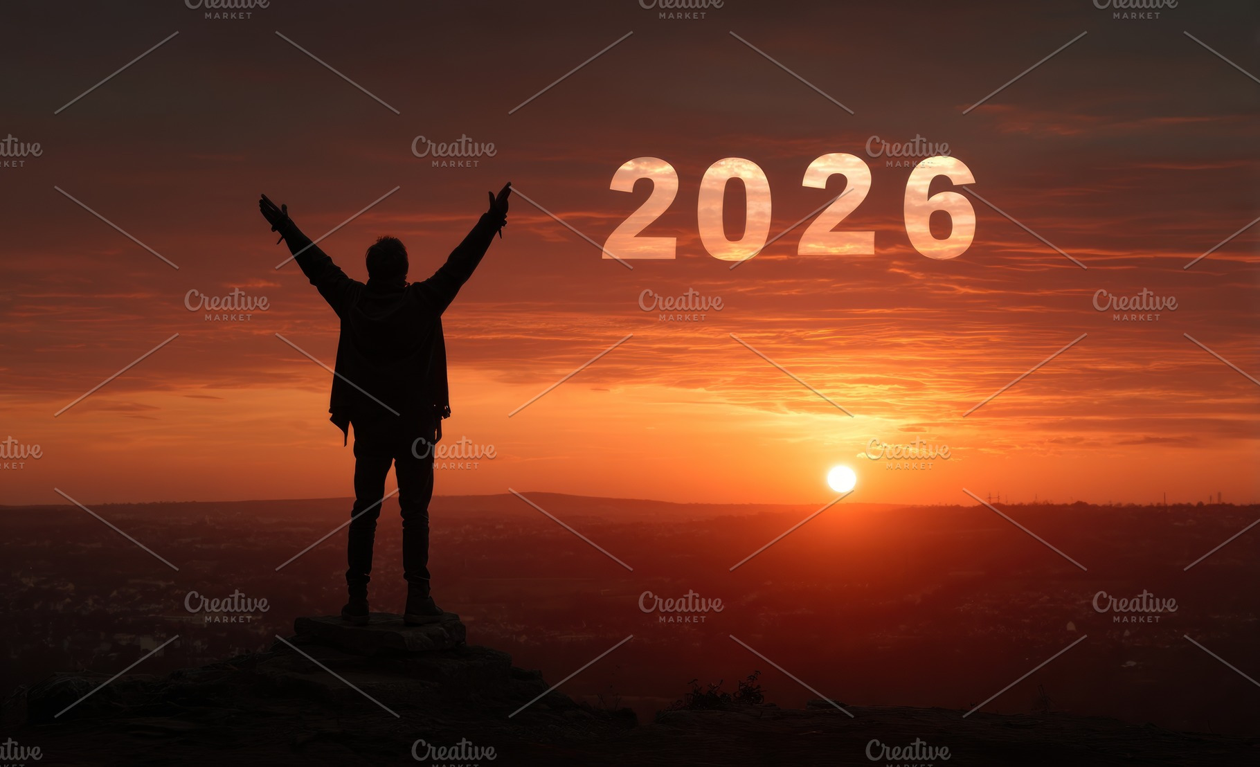 Man celebrating success on mountain peak at sunrise with 2026 in, a Person Photo by José Manuel Gelpi