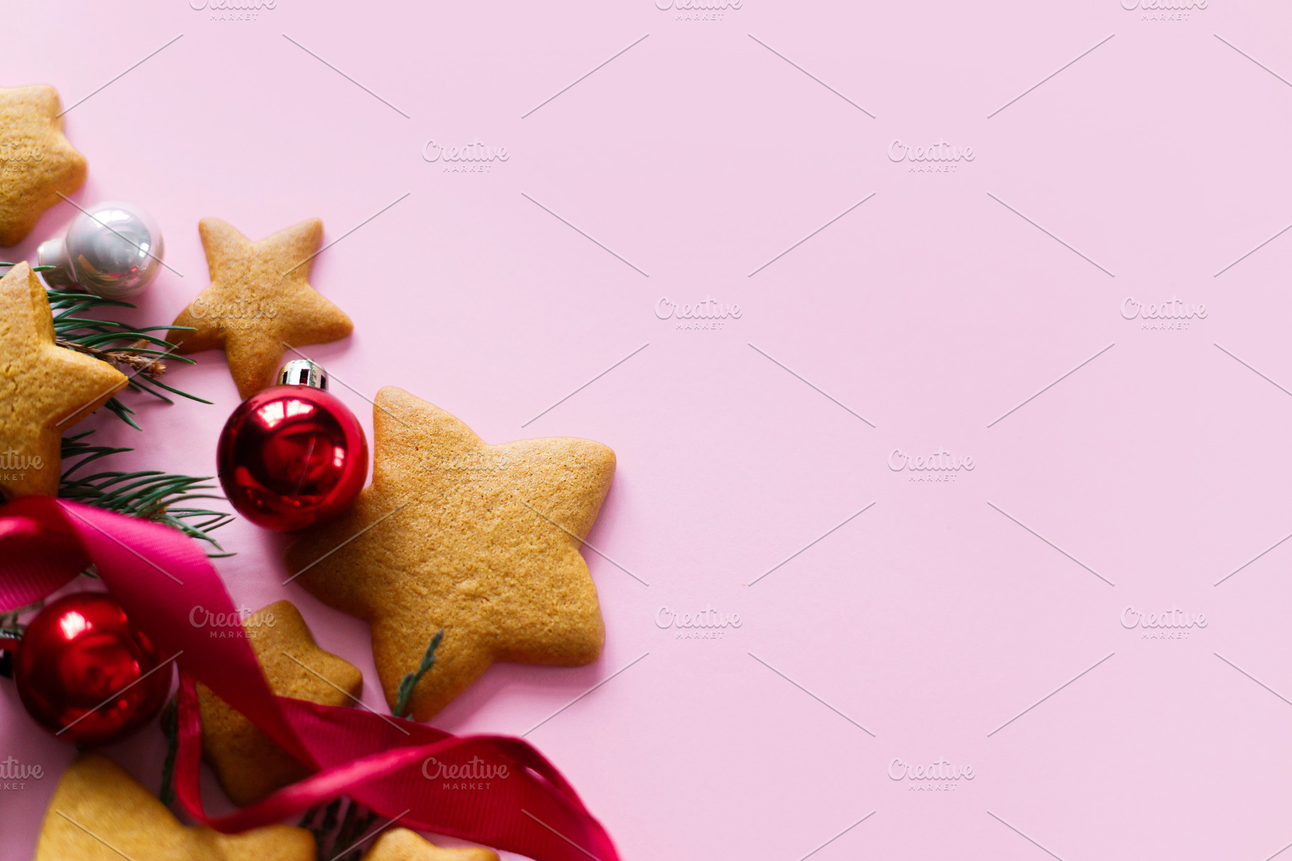 Christmas background with star gingerbread cookies, red baubles, a Photo by Sonjachni