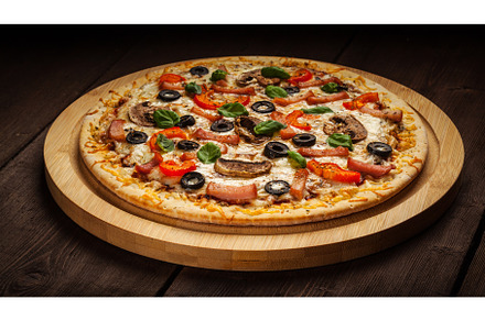 Ham pizza on wooden background, a Food & Drink Photo by f9photos