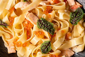 Creamy tagliatelle italian cuisine salmon leaves, a Food & Drink Photo by Photo Drive Studio