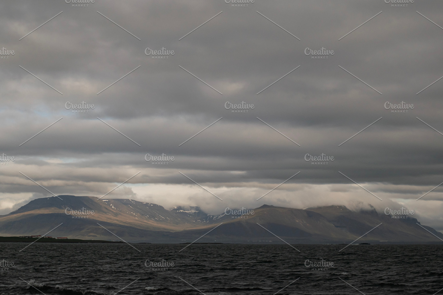 Cloudy mountain landscape near Akranes, Iceland, with dramatic sky and serene w, a Photo by AS photostudio