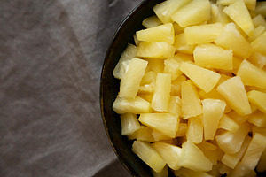 Canned Pineapple Tidbit Chunks in a Bowl, top view. Copy space., a Food & Drink Photo by LiudmylaChuhunova