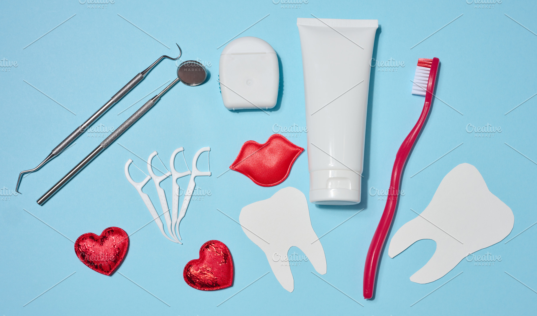 Set of oral hygiene products and tools, tube of toothpaste, dent, a Health & Medical Photo by ndanko