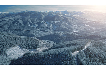 Aerial sunrise over snow mountain, a Nature Photo by Goinyk