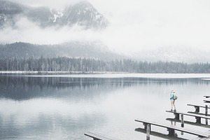 Tourist at winter mountain lake containing active, activity, and adventure
