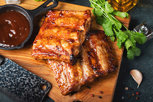Spicy hot grilled spare ribs from a summer BBQ served with a hot chili pepper a, a Food & Drink Photo by Budarinphoto
