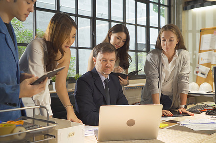 A group of multi ethnic business team talk, communicate, discuss, a Photo by Tampatra