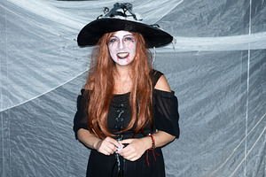 Smiling woman dressed as a witch at Halloween party, a Person Photo by etorres69