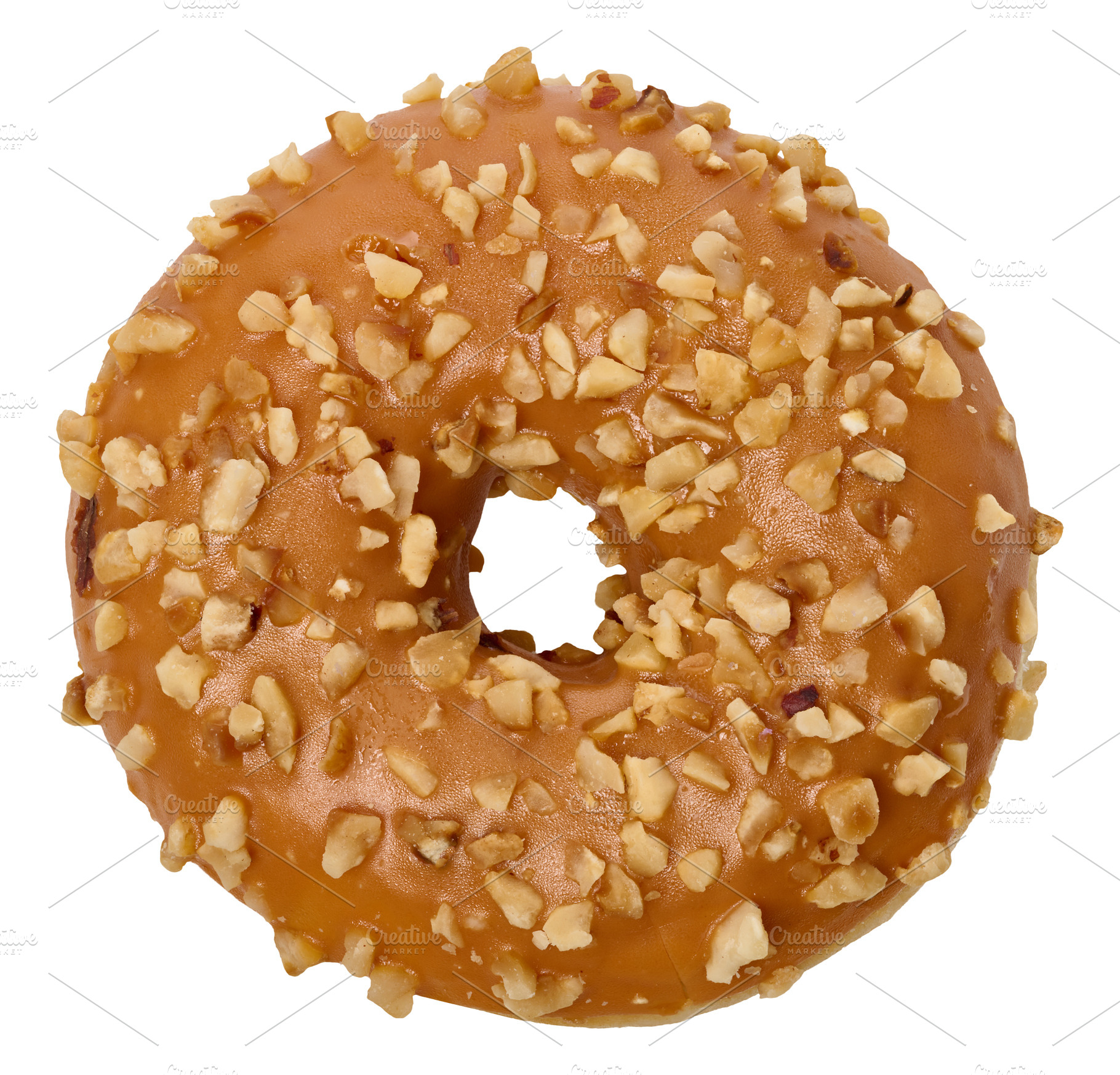 Caramel-glazed donut with nut crumbles on an isolated background, a Food & Drink Photo by ndanko