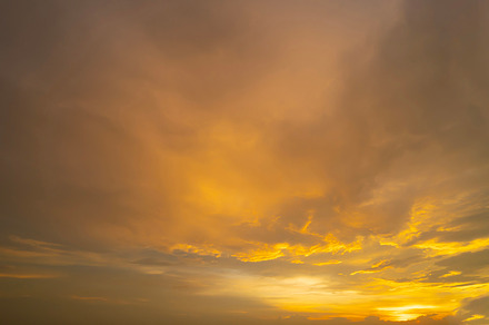 Sunset sky. Abstract nature background. Dramatic blue with orang, a Background Photo by Tampatra