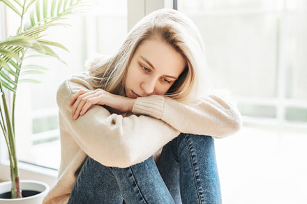 Sad girl near window thinking about something, a Person Photo by Olena Rudo