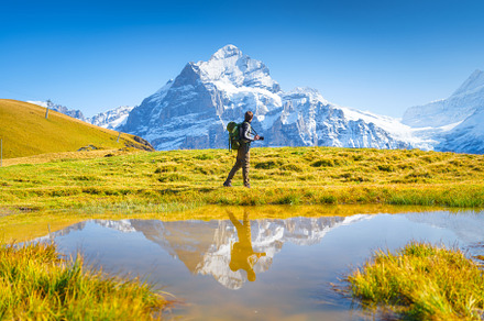 Tourist with a backpack. Switzerland, a Person Photo by Landscape and travel