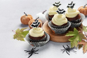 Halloween cupcakes with bats, pumpkins, and autumn leaves, a Food & Drink Photo by Olena Rudo