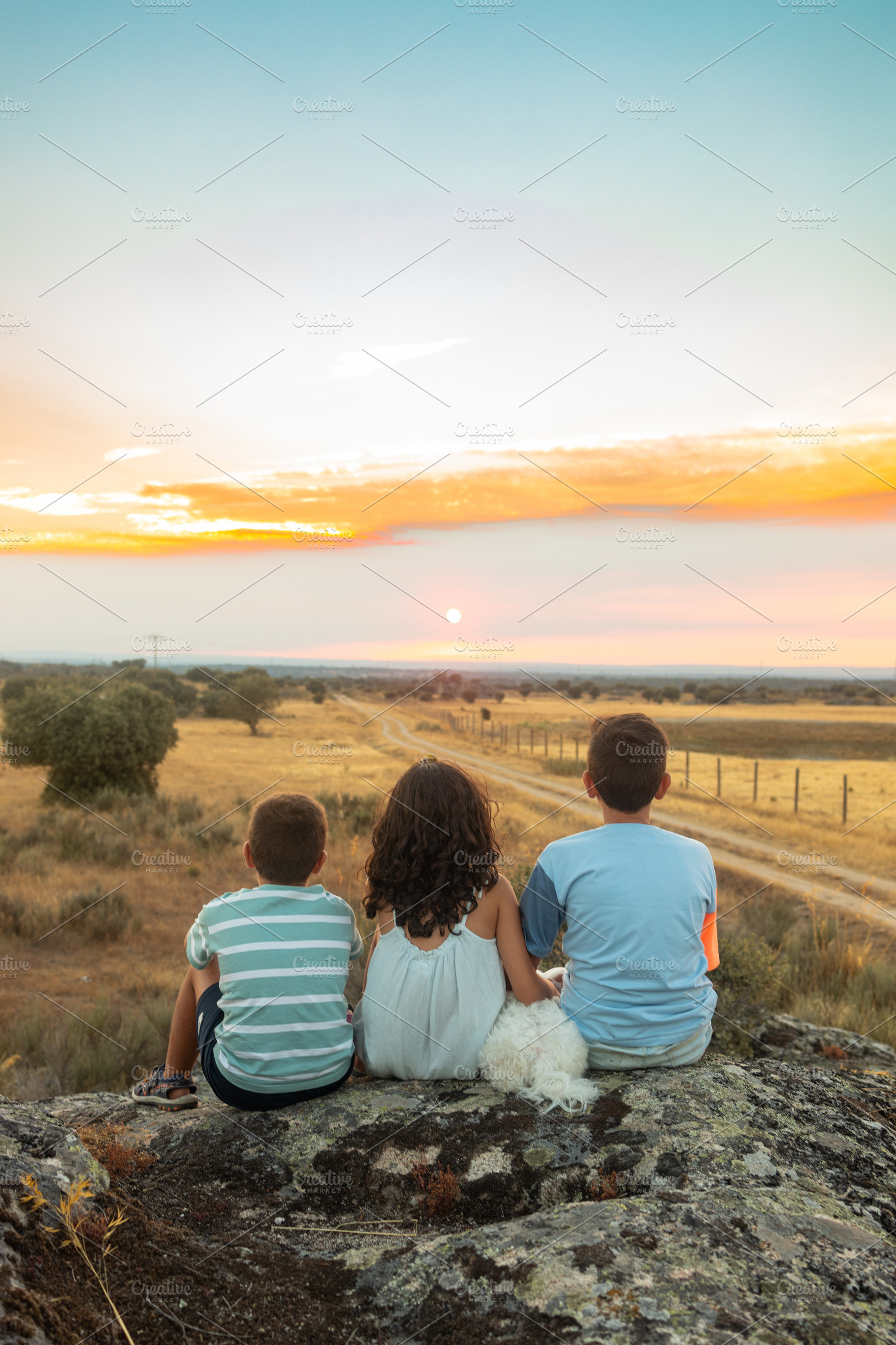 Three friends looking the sunset in a summer day, a Person Photo by Cosca