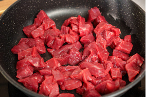 Freshly cut beef cubes cooking in a, a Food & Drink Photo by darksoul72