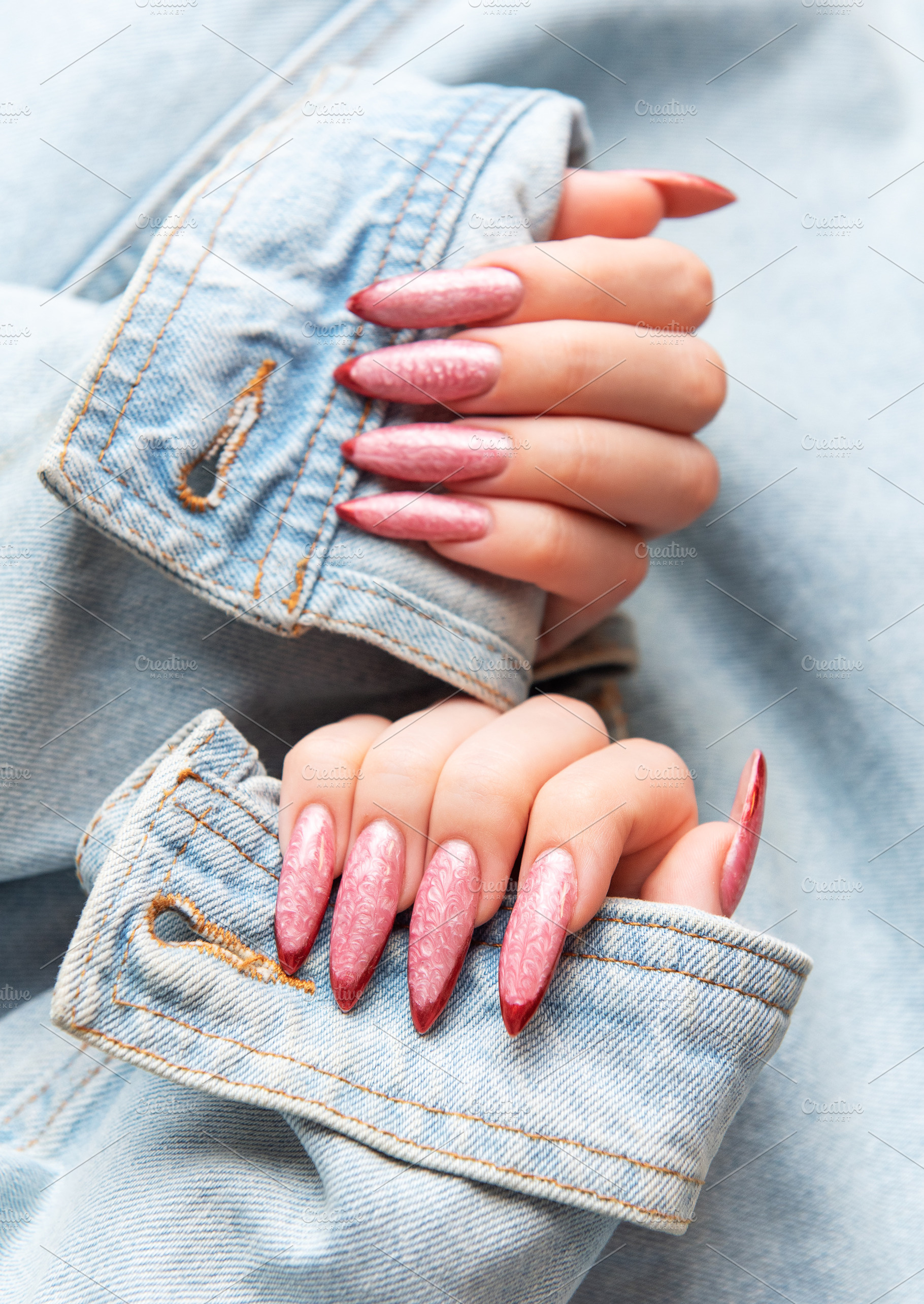 Woman showing trendy pink stiletto nails with denim jacket, a Beauty & Fashion Photo by Olena Rudo